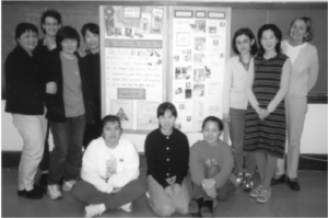 Charlottesville teachers and learners with their HEAL community wall.