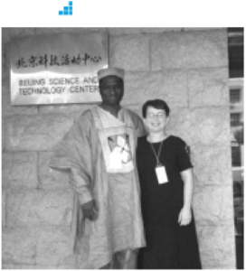 UNESCO official Adama Ouane posing with Maureen Dooley.
