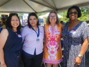 photograph of four smiling women